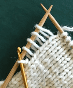 image of knitted yarn and needles