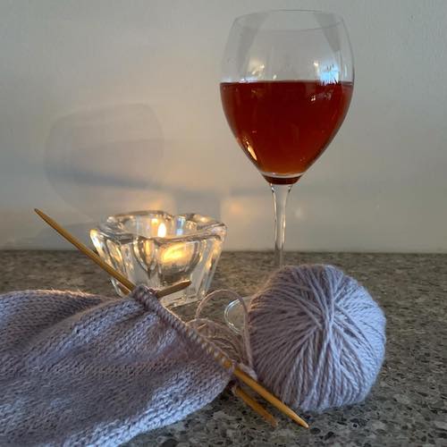 Knitters Guild Ball of yarn, wine glass and candle