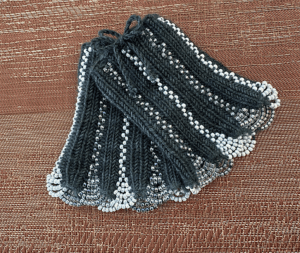 Two knit, beaded wrist cuffs