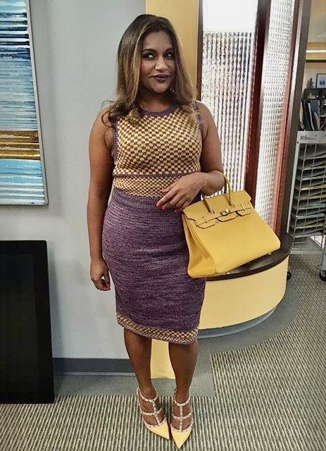 Photo of the actress Mindy Kaling wearing a hand knit sleeveless top and skirt.