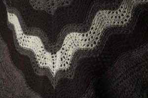 Close up of a grey and black hap shawl