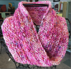 A pink, hand knit moebius cowl