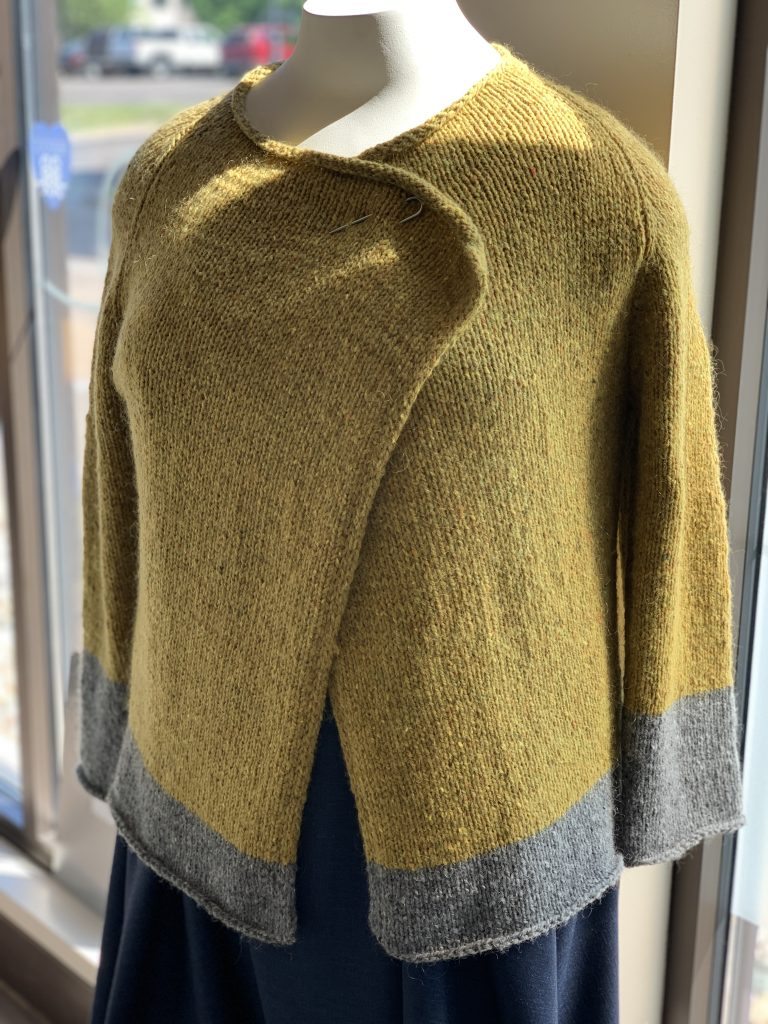 Mossy green cardigan with a gray bottom on the body and the sleeve