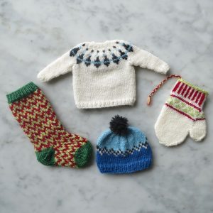 hand knit tiny sweater, stocking, hat, and mitten