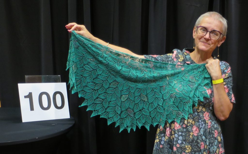 Woman showing a green lace shawl