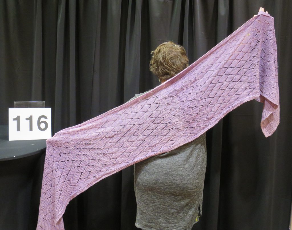 Woman modeling large purple shawl
