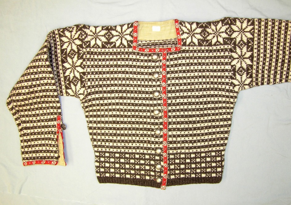 A Norwegian sweater in black and white with red trim