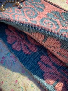 A two sided colorwork cowl in pink and blue