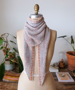 hand knit scarf on a dress form